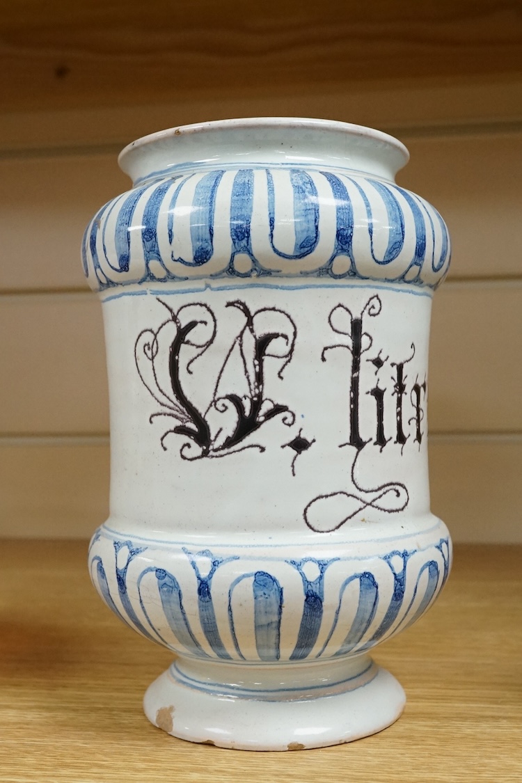 An 18th century Savona maiolica Albarello, inscribed in Manganese; ‘V. litragirio’ (lead oxide), 19cm high
